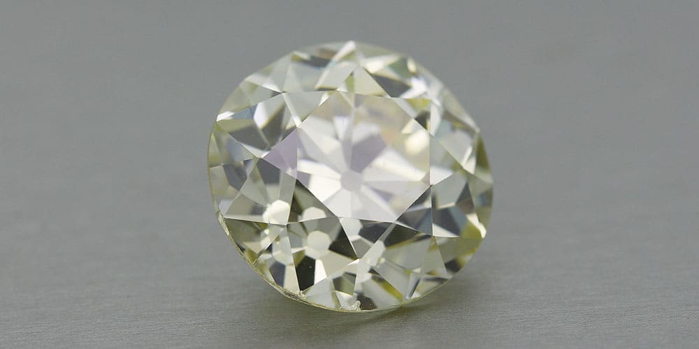 Why do most antique diamonds in the market are not colorless